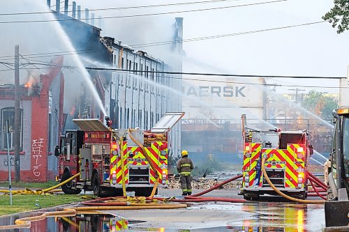 MIKE DEAL / WINNIPEG FREE PRESS
WFPS crews try to douse a large fire in the block on the southwest corner of Sutherland Avenue and Maple Street North Tuesday morning. 
230704 - Tuesday, July 4, 2023. 