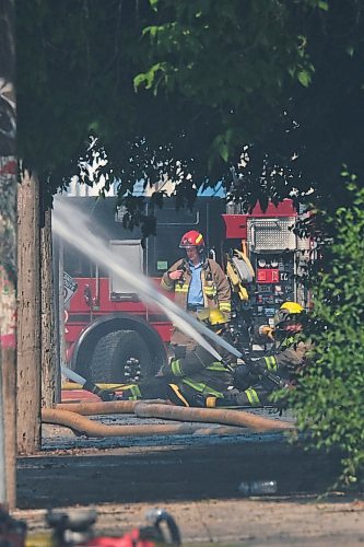 MIKE DEAL / WINNIPEG FREE PRESS
WFPS crews try to douse a large fire in the block on the southwest corner of Sutherland Avenue and Maple Street North Tuesday morning. 
230704 - Tuesday, July 4, 2023. 
