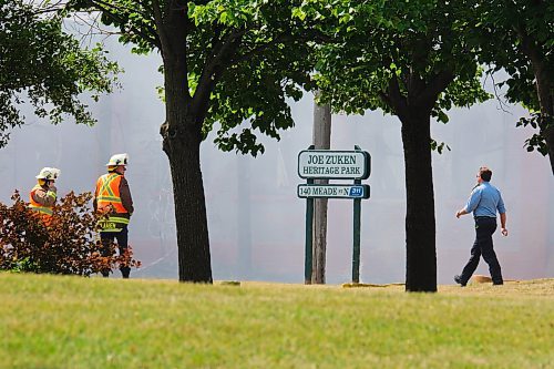 MIKE DEAL / WINNIPEG FREE PRESS
WFPS crews try to douse a large fire in the block on the southwest corner of Sutherland Avenue and Maple Street North Tuesday morning. 
230704 - Tuesday, July 4, 2023. 
