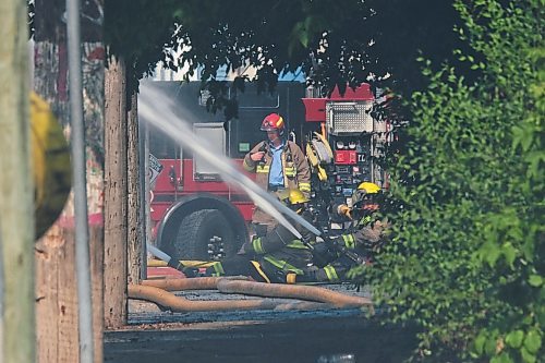 MIKE DEAL / WINNIPEG FREE PRESS
WFPS crews try to douse a large fire in the block on the southwest corner of Sutherland Avenue and Maple Street North Tuesday morning. 
230704 - Tuesday, July 4, 2023. 
