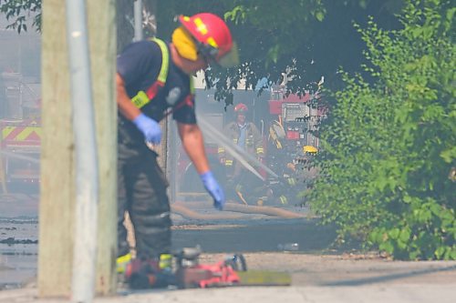 MIKE DEAL / WINNIPEG FREE PRESS
WFPS crews try to douse a large fire in the block on the southwest corner of Sutherland Avenue and Maple Street North Tuesday morning. 
230704 - Tuesday, July 4, 2023. 
