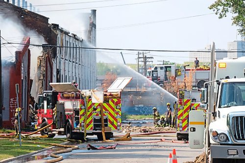 MIKE DEAL / WINNIPEG FREE PRESS
WFPS crews try to douse a large fire in the block on the southwest corner of Sutherland Avenue and Maple Street North Tuesday morning. 
230704 - Tuesday, July 4, 2023. 
