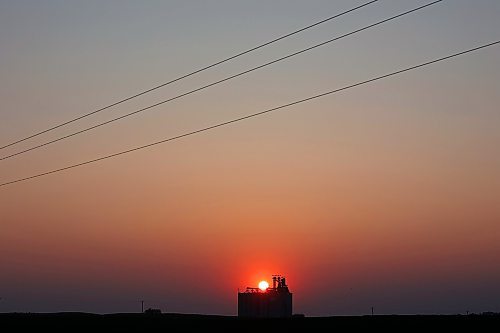 03072023
The sun sets west of a grain terminal near Boissevain, Manitoba on a warm and clear Monday evening. (Tim Smith/The Brandon Sun)