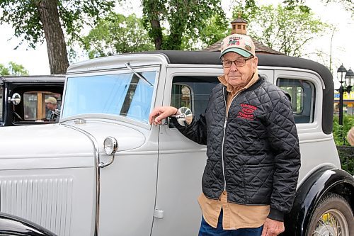David Allinson, 93, poses with his 1931 Ford Model A two-door Victoria at the Daly House Museum on Wednesday. Allinson was part of a group driving across the province for the three-day Pine to Prairie Relic Run. (Michele McDougall/The Brandon Sun)
