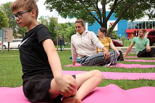 05072023
Austin Boyce, Kamryn Johnson, Neesa Walowetz and Raven Mckenzie take part in Yoga In The Park at Princess Park in Brandon on Wednesday. The weekly noon-hour yoga session is organized by the Brandon Neighbourhood Renewal Corporation. Their Rosser &amp; Around Downtown Ambassadors also host youth activities on Tuesdays and coffee in the park on Thursdays. (Tim Smith/The Brandon Sun)