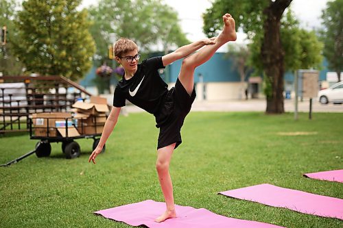 05072023
Twelve-year-old Austin Boyce takes part in Yoga In The Park at Princess Park in Brandon on Wednesday. The weekly noon-hour yoga session is organized by the Brandon Neighbourhood Renewal Corporation. Their Rosser &amp; Around Downtown Ambassadors also host youth activities on Tuesdays and coffee in the park on Thursdays. (Tim Smith/The Brandon Sun)
