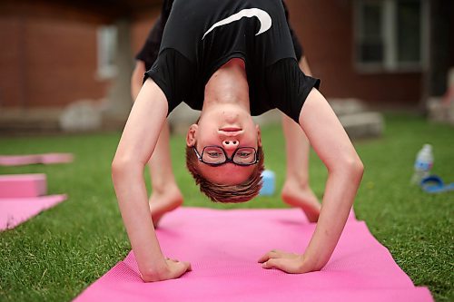 05072023
Twelve-year-old Austin Boyce takes part in Yoga In The Park at Princess Park in Brandon on Wednesday. The weekly noon-hour yoga session is organized by the Brandon Neighbourhood Renewal Corporation. Their Rosser &amp; Around Downtown Ambassadors also host youth activities on Tuesdays and coffee in the park on Thursdays. (Tim Smith/The Brandon Sun)