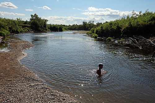 05072023
Cole Hartman, eight, swims in the Little Saskatchewan River with friends during an afternoon exploring the river west of Brandon on Wednesday.  (Tim Smith/The Brandon Sun)