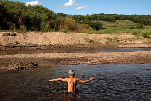 05072023
Cole Hartman, eight, wades in the Little Saskatchewan River with friends during an afternoon exploring the river west of Brandon on Wednesday.  (Tim Smith/The Brandon Sun)