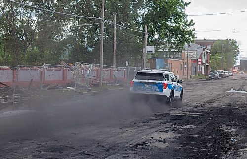 Mike Thiessen / Winnipeg Free Press 
Cadets leaving the site of Tuesday&#x2019;s warehouse fire in Point Douglas. Sutherland Avenue is no longer blocked off, but the street is still covered in debris. 230705 &#x2013; Wednesday, July 5, 2023