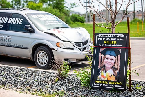 MIKAELA MACKENZIE / WINNIPEG FREE PRESS

An impaired driving awareness vehicle, dropped off by MADD Canada, and a lawn sign honouring Jordyn Reimer&#x573; memory by Regent Avenue near the Beer Boutique on Thursday, July 6, 2023.  For Cierra Bettens story.
Winnipeg Free Press 2023.