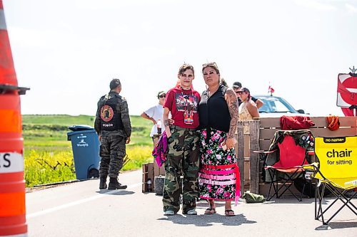 MIKAELA MACKENZIE / WINNIPEG FREE PRESS

Cambria Harris (left) and Melissa Robinson pose for a photo at the blockade/camp outside the Brady Landfill after the province announced that they will not be funding a landfill search for the murdered women on Thursday, July 6, 2023.  For Chris Kitching story.
Winnipeg Free Press 2023.