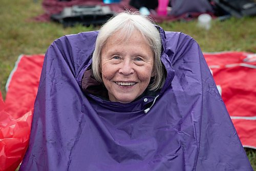 JESSICA LEE / WINNIPEG FREE PRESS

Virginia Kowalski attempts to keep dry at Folk Fest July 6, 2023.

Reporter: Eva Wasney