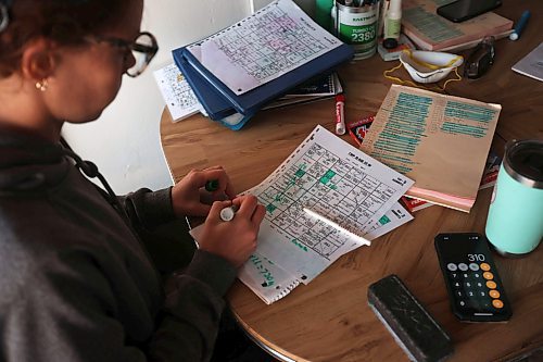 07072023
Stefanie Lepp with Rivers Air Spray, maps out a spraying itinerary for her dad John&#x2019;s next load with his Air Tractor AT-802F at the former CFB Rivers base near Wheatland, Manitoba during a busy day of aerial spraying on Friday. 
(Tim Smith/The Brandon Sun)