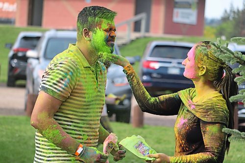 Local residents gather at Dinsdale Park Saturday evening to partake in a belated celebration of Holi, the Indian festival of colours. See Page A2 for more coverage. (Kyle Darbyson/The Brandon Sun)