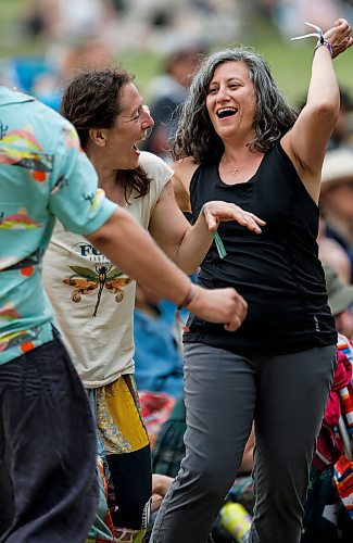 JOHN WOODS / WINNIPEG FREE PRESS
Barb Curchack, right, and her friend Kat Rother dance as Finjan performs on the Big Bluestem stage at the Winnipeg Folk Festival in Birds Hill Park Sunday, July 9, 2023.