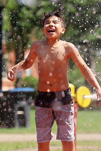 Eleven-year-old Rocklin (no last name given) smiles while enjoying the Stanley Park spray park in Brandon on a warm Monday afternoon. (Tim Smith/The Brandon Sun)