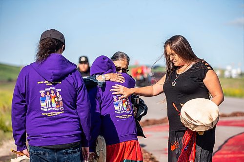 MIKAELA MACKENZIE / WINNIPEG FREE PRESS

Carl Ullrich (left), Leslie Spillett, and Terri-Lee Bousquet comfort Sue Caribou after a song at the Brady Road blockade on Monday, July 10, 2023.  For Chris Kitching story.
Winnipeg Free Press 2023.