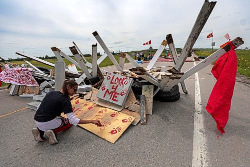 RUTH BONNEVILLE / WINNIPEG FREE PRESS

Local  - Brady landfill

Diane Bousquet paints a sign with red paint at blockade Tuesday. 

About 10 - 15 people, including some children, remain stationed behind old tires stacked up and filled with lumber on Tuesday afternoon. 

This is the 5th day of the blockade along the road to the entrance of of Winnipeg's Brady landfill site which families and supporters want searched for the rremains their murdered loved ones.


July 11th,  2023
