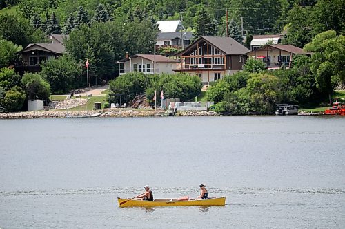 A pair of canoeists paddle on Minnedosa Lake on a warm Tuesday. (Tim Smith/The Brandon Sun)