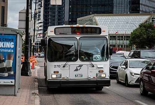 JESSICA LEE / WINNIPEG FREE PRESS

A bus is photographed on Main Street during rush hour July 12, 2023.

Reporter: Joyanne