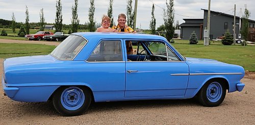 A 1964 AMC Rambler, nicknamed 'The Rumbler', with owner Chad Bicklmeier from Rivers, and his co-pilot Lynda Lambert from Morden near Brandon on Wednesday. The Rumbler will be among the hundreds of vehicles at this weekend's Western Canada Power Cruise in Medicine Hat, AB. (Michele McDougall/The Brandon Sun)
