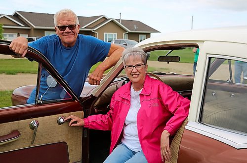 Butch and Val Buchanan of Fargo, N.D, and their 954 Kaiser Special near Brandon on Wednesday. There were less than 8,000 of these vehicles built by automobile executive Joseph W. Frazer and industrialist Henry J. Kaiser, who started their company to compete with General Motors, Ford, and Chrysler, but halted production in 1955. The Buchanans will be among the hundreds of car enthusiasts at this weekend's Western Canada Power Cruise in Medicine Hat, AB. (Michele McDougall/The Brandon Sun)