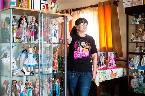 MIKAELA MACKENZIE / WINNIPEG FREE PRESS

President of the Manitoba Dolls Club Lucy Cook with her impressive Barbie collection on Thursday, July 13, 2023.  For AV Kitching story.
Winnipeg Free Press 2023.