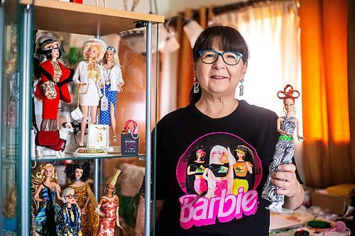 MIKAELA MACKENZIE / WINNIPEG FREE PRESS

President of the Manitoba Dolls Club Lucy Cook with her impressive Barbie collection on Thursday, July 13, 2023.  For AV Kitching story.
Winnipeg Free Press 2023.