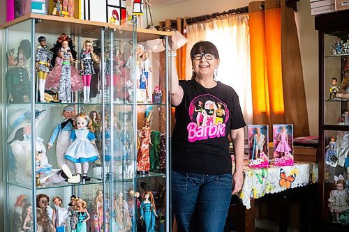 MIKAELA MACKENZIE / WINNIPEG FREE PRESS

President of the Manitoba Dolls Club Lucy Cook with her impressive Barbie collection on Thursday, July 13, 2023.  For AV Kitching story.
Winnipeg Free Press 2023.