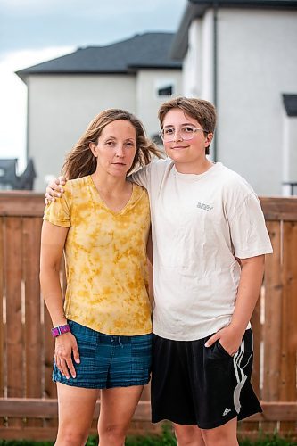 MIKAELA MACKENZIE / WINNIPEG FREE PRESS

Jill Chapman and her son, Adam Donaghy, at their home on Thursday, July 13, 2023. Adam Donaghy is a transgender high schooler who has been on the waiting list for HSC&#x2019;s Gender Dysphoria Assessment and Action for Youth Centre (GDAAY) program for nearly three years.  For Eva/Katie story.
Winnipeg Free Press 2023.