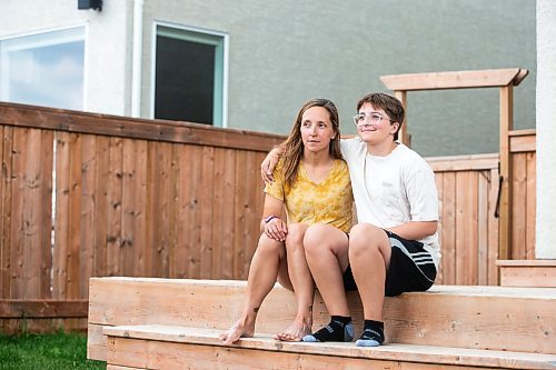 MIKAELA MACKENZIE / WINNIPEG FREE PRESS

Jill Chapman and her son, Adam Donaghy, at their home on Thursday, July 13, 2023. Adam Donaghy is a transgender high schooler who has been on the waiting list for HSC&#x2019;s Gender Dysphoria Assessment and Action for Youth Centre (GDAAY) program for nearly three years.  For Eva/Katie story.
Winnipeg Free Press 2023.