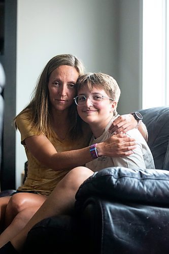 MIKAELA MACKENZIE / WINNIPEG FREE PRESS

Jill Chapman and her son, Adam Donaghy, at their home on Thursday, July 13, 2023. Adam Donaghy is a transgender high schooler who has been on the waiting list for HSC&#x2019;s Gender Dysphoria Assessment and Action for Youth Centre (GDAAY) program for nearly three years.  For Eva/Katie story.
Winnipeg Free Press 2023.