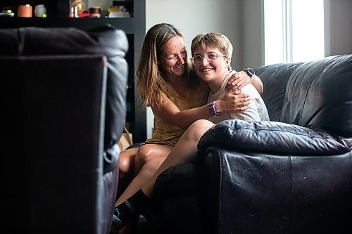 MIKAELA MACKENZIE / WINNIPEG FREE PRESS

Jill Chapman and her son, Adam Donaghy, at their home on Thursday, July 13, 2023. Adam Donaghy is a transgender high schooler who has been on the waiting list for HSC&#x2019;s Gender Dysphoria Assessment and Action for Youth Centre (GDAAY) program for nearly three years.  For Eva/Katie story.
Winnipeg Free Press 2023.