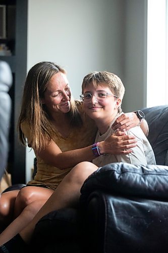 MIKAELA MACKENZIE / WINNIPEG FREE PRESS

Jill Chapman and her son, Adam Donaghy, at their home on Thursday, July 13, 2023. Adam Donaghy is a transgender high schooler who has been on the waiting list for HSC&#x2019;s Gender Dysphoria Assessment and Action for Youth Centre (GDAAY) program for nearly three years.  For Eva/Katie story.
Winnipeg Free Press 2023.