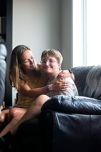 MIKAELA MACKENZIE / WINNIPEG FREE PRESS

Jill Chapman and her son, Adam Donaghy, at their home on Thursday, July 13, 2023. Adam Donaghy is a transgender high schooler who has been on the waiting list for HSC&#x2019;s Gender Dysphoria Assessment and Action for Youth Centre (GDAAY) program for nearly three years.  For Eva/Katie story.
Winnipeg Free Press 2023.