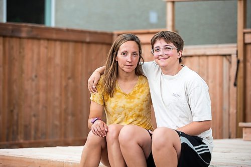 MIKAELA MACKENZIE / WINNIPEG FREE PRESS

Jill Chapman and her son, Adam Donaghy, at their home on Thursday, July 13, 2023. Adam Donaghy is a transgender high schooler who has been on the waiting list for HSC&#x2019;s Gender Dysphoria Assessment and Action for Youth Centre (GDAAY) program for nearly three years.  For Eva/Katie story.
Winnipeg Free Press 2023.