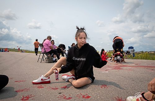 JESSICA LEE / WINNIPEG FREE PRESS

Cassidy Assiniboine makes red hand prints at the Brady Landfill blockade July 13, 2023. 

Reporter: Tyler Searle /Chris Kitching