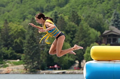 13072023
Twelve-year-old Eastyn Beach leaps off a tower while playing with family at the Splish Splash Water Park at Minnedosa Lake on a sunny Thursday. (Tim Smith/The Brandon Sun)