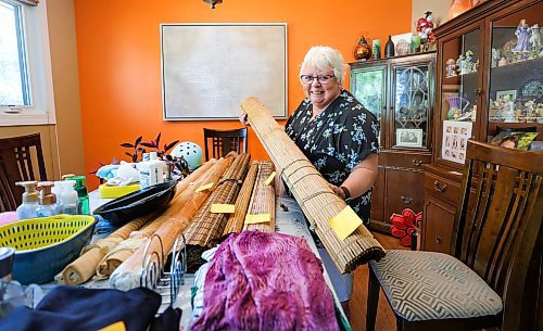 RUTH BONNEVILLE / WINNIPEG FREE PRESS

GREEN PAGE - Free stuff 

Photo of Sharon Malec with a table full of stuff she is giving away including wicker rollup blinds.  She belonged to two Buy Nothing groups and loves them.

Story: The best things in life are free. Buy Nothing groups are a goldmine for many and they&#x2019;re growing in popularity. Not only can you get all kinds of stuff for free but people will come and haul away your stuff for free. 

Reporter: Janine LeGal 

July 6th,  2023

