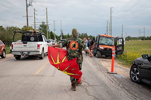 JESSICA LEE / WINNIPEG FREE PRESS

A protestor walks towards city employees July 14, 2023 who have just arrived at Brady Landfill.

Reporter: Chris Kitching