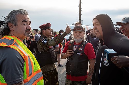 JESSICA LEE / WINNIPEG FREE PRESS

A protestor (right) shares their thoughts with the police liaison (left) at Brady Landfill July 14, 2023 after the police liaison tells the protestors they have to leave.

Reporter: Chris Kitching