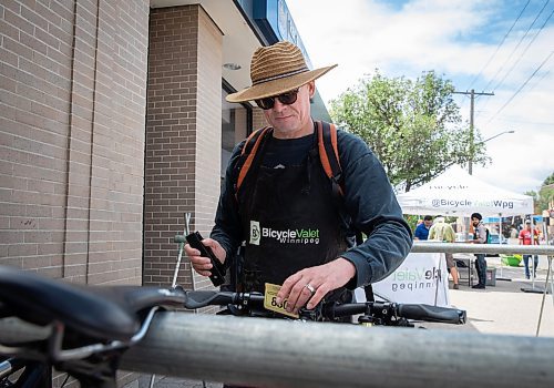 JESSICA LEE / WINNIPEG FREE PRESS

Steve West is photographed July 15, 2023 at Sargent Ave., tending to the bike valet, which West End Biz has set up to increase street traffic to the area. 

Reporter: Cierra
