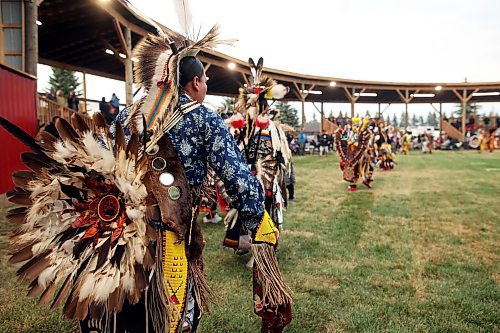 14072023
Dancers make their way into the arbour for the Grand Entry at the Sioux Valley Dakota Nation Dakota Oyate Wacipi Powwow on Friday evening. Sioux Valley debuted a new Powwow arbour for the annual event. 
(Tim Smith/The Brandon Sun)