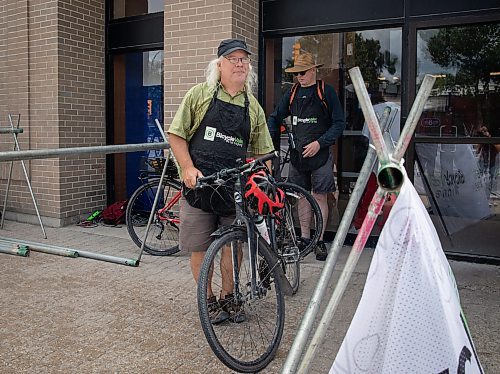 JESSICA LEE / WINNIPEG FREE PRESS

Mark Cohoe, executive director of Bike Winnipeg, is photographed July 15, 2023 at Sargent Ave., tending to the bike valet, which West End Biz has set up to increase street traffic to the area. 

Reporter: Cierra