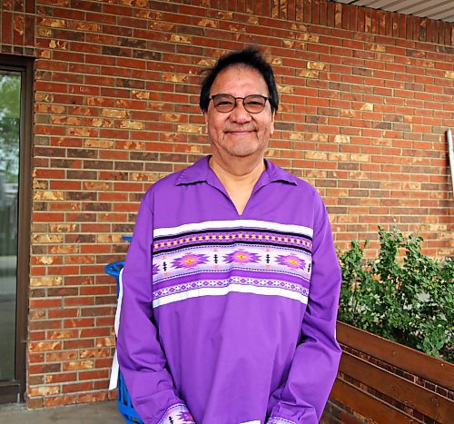 Marcel Ross from Cross Lake in northern Manitoba, poses for a photo at his graduation from BU's PENT in Brandon on Friday. PENT stands for Program for the Education of Native Teachers. (Michele McDougall, The Brandon Sun)

