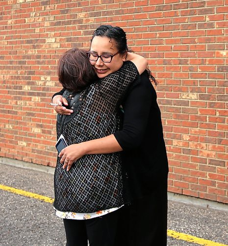 Lori Campbell from Moose Lake in northern Manitoba gets a congratulatory hug from a relative at her graduation from BU's PENT in Brandon on Friday. PENT stands for Program for the Education of Native Teachers. (Michele McDougall, The Brandon Sun)