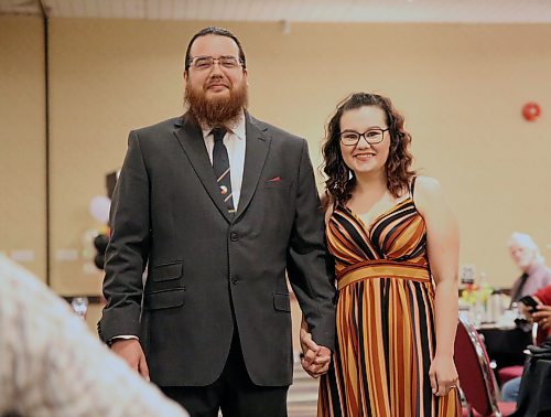 A recent graduate of BU's PENT and his escort at the ceremony in Brandon on Friday. PENT stands for Program for the Education of Native Teachers. (Michele McDougall, The Brandon Sun)