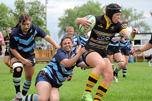 Brandon Barbarians Lenea Gervin tackles a Winnipeg Wasps ball carrier. (Thomas Friesen/The Brandon Sun)