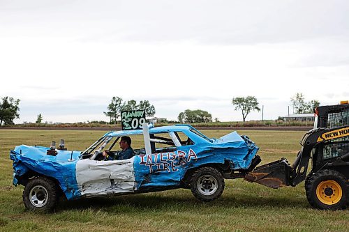 15072023
Chris Flannery of Virden gets a helping hand from a loader to get his car back to his trailer after competing in the demolition derby at the end of the Deloraine Summer Fair on Saturday evening. Nine cars competed in the derby in front of a packed grandstand of fair-goers. The event included two heats, a consolation round and a final. The fair also included a steak fry, live music, kids events, a cornhole tournament and other activities.
(Tim Smith/The Brandon Sun)